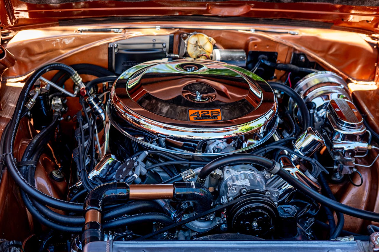 services-01 A detailed close-up shot of a vintage 426 Hemi engine, showcasing intricate automotive craftsmanship.