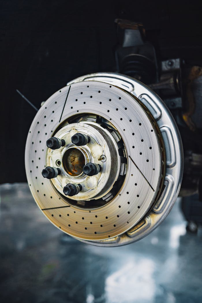 footer-cta-img Steel automobile disk brake without wheel for car service and repair concept